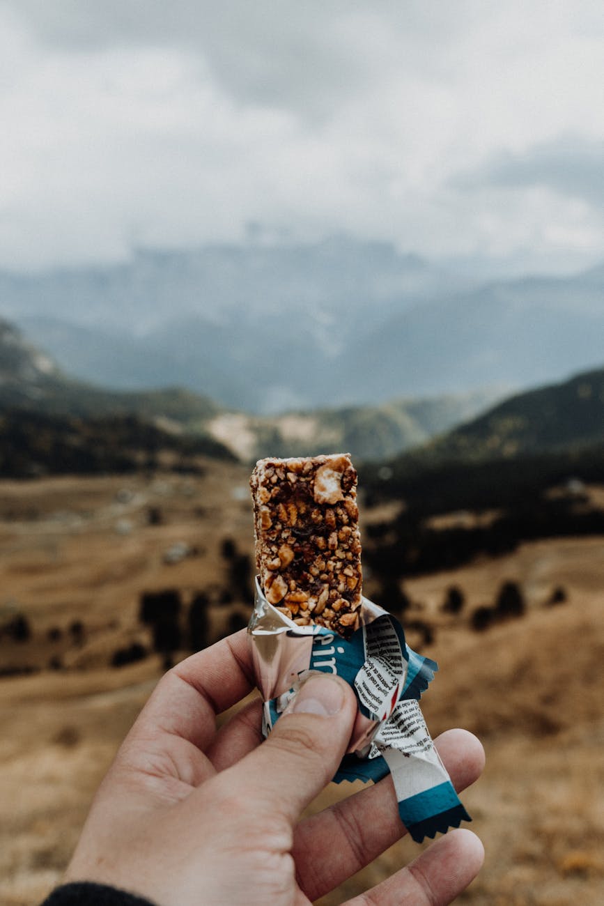 photo of person holding a cereal bar