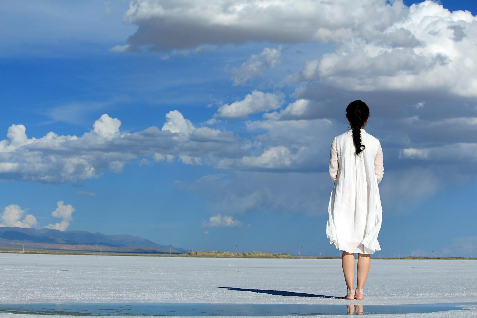 woman with umbrella on beach