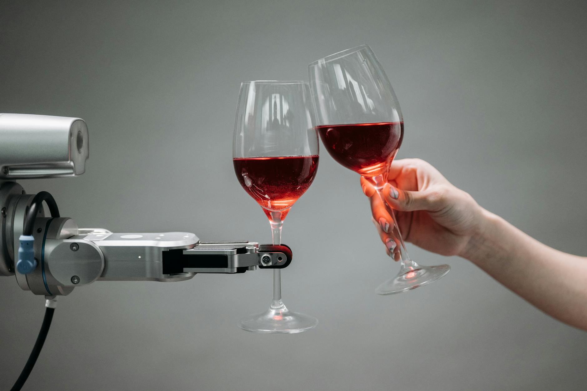 a robot holding a wine